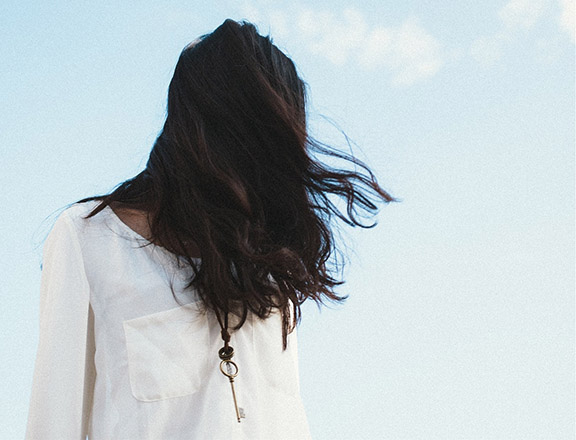 girl with key necklace