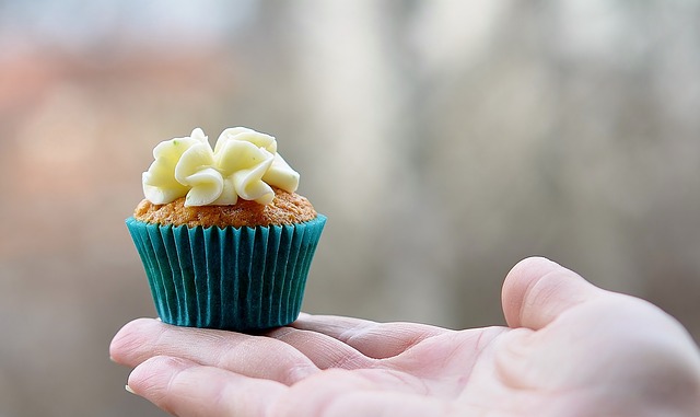 hand holding tiny cupcake